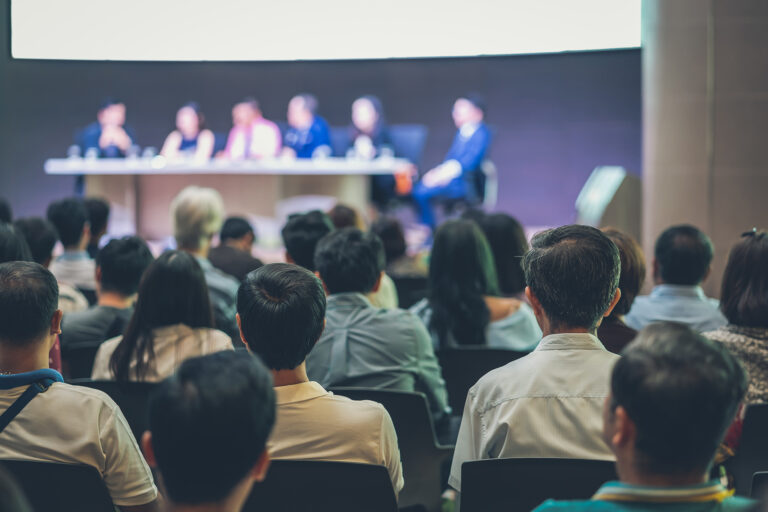 Rear view of Audience in the conference hall or seminar meeting